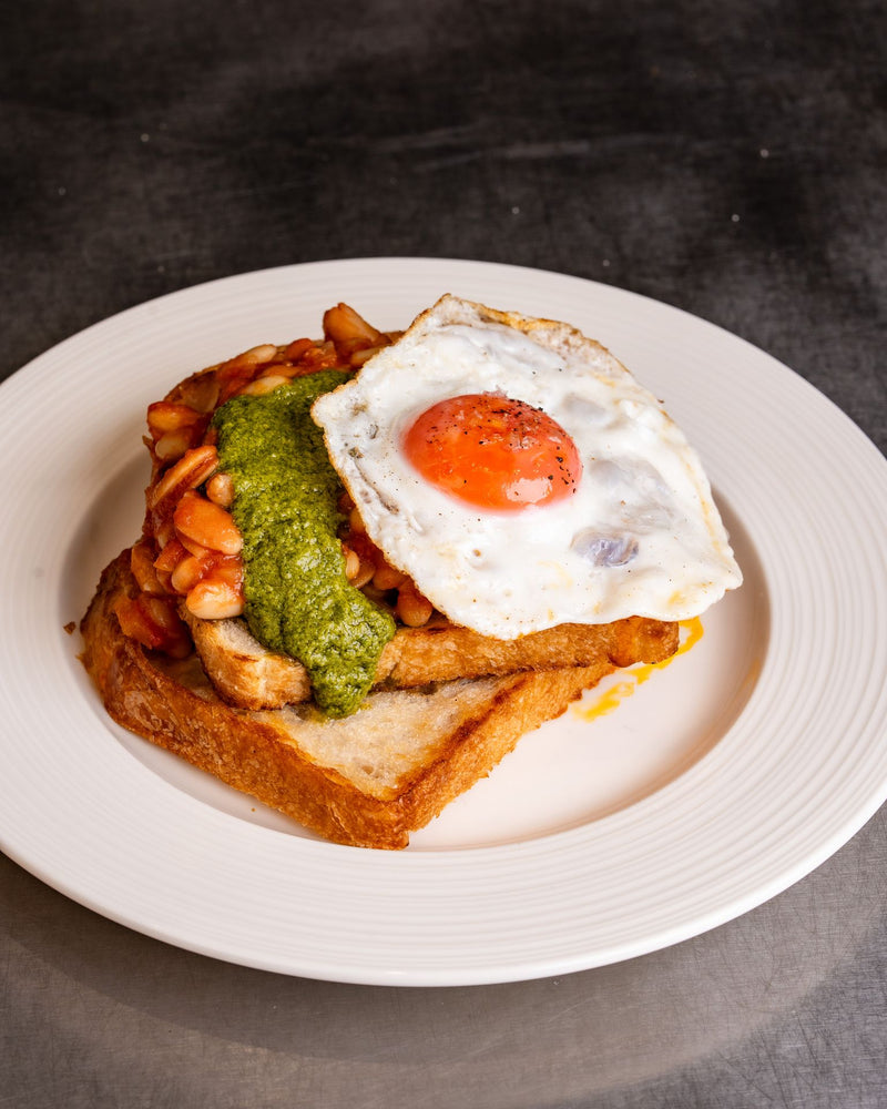 Crispy chips with fried egg and green sauce served at The Focacceria Belfast