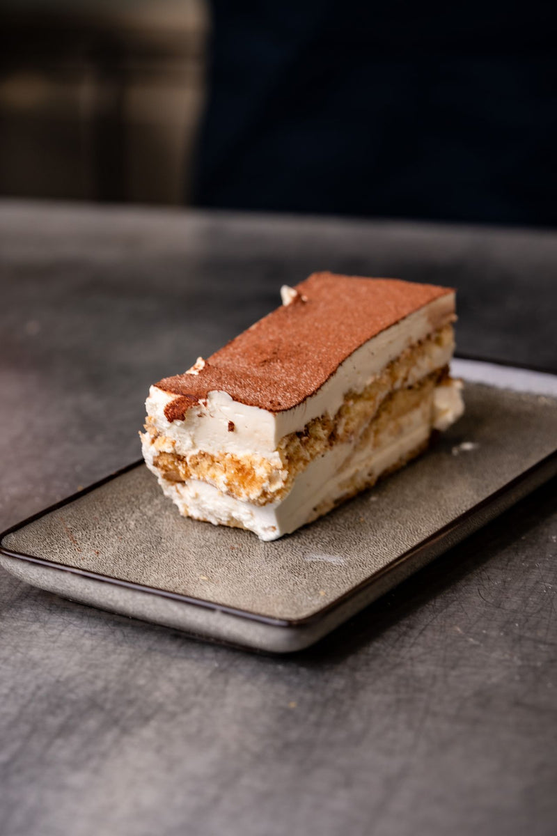 Slice of creamy tiramisu-style dessert served at The Focacceria, Upstairs @ House Proud Furniture on Boucher Road Belfast
