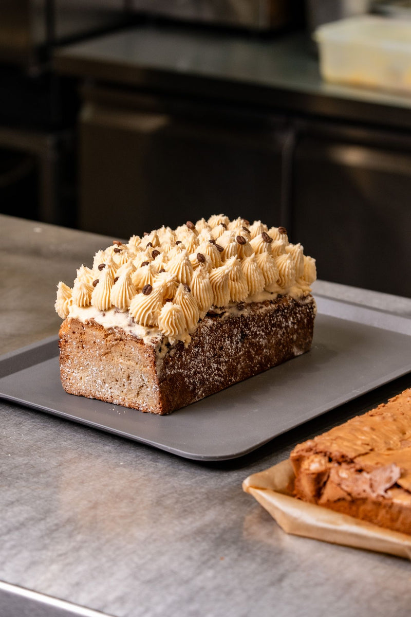 Freshly piped cake topped with cream and chocolate pieces from The Focacceria Belfast